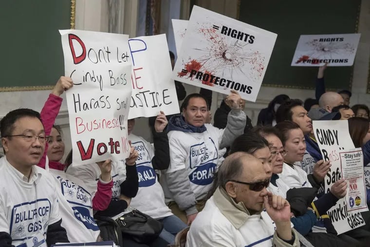Hundreds gather inside City Council Chambers December 4, 2017 to rally against a bill introduced by Councilwoman Cindy Bass that would force beer deli owners, many of whom are Asian immigrants or their descendants, to take down protective safety windows in their establishments.