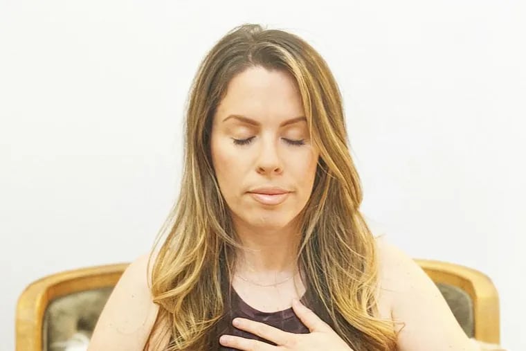 Ashley Greenblatt demonstrates belly breathing.