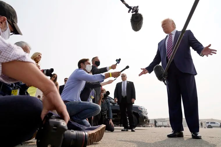 President Donald Trump speaks to reporters in McClellan Park, Calif., where he visited Monday for a briefing on wildfires ravaging the west coast.