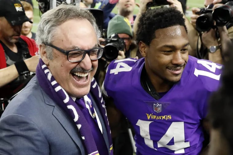 Minnesota Vikings owner Zygi Wilf, left, celebrates with Stefon Diggs (14) following a 29-24 win over the New Orleans Saints in Sunday’s NFL divisional  playoff game.