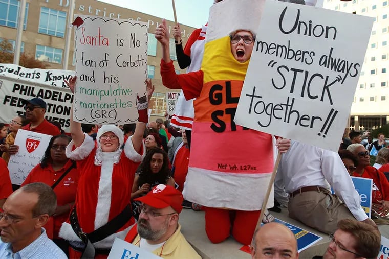 Maureen Braun, dressed as a glue stick and a teacher at Spuance Elementary let her voice be heard in front of School District headquarters Thursday afternoon during the protest agaisnt the SRC.