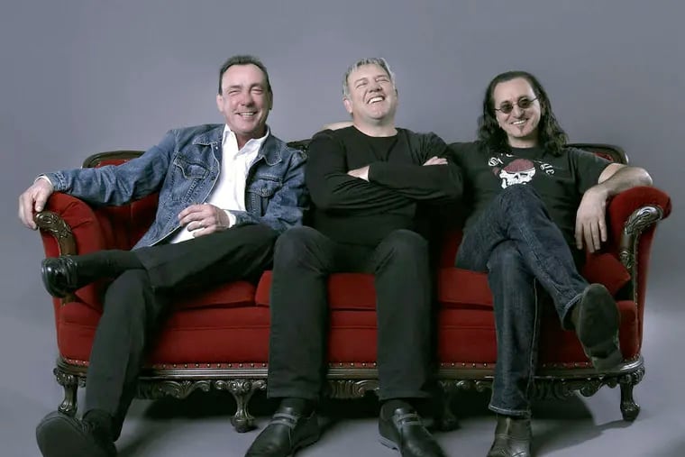 Members of Rush (from left) drummer Neil Peart, guitarist Alex Lifeson, and bassist-keyboardist-lead singer Geddy Lee.