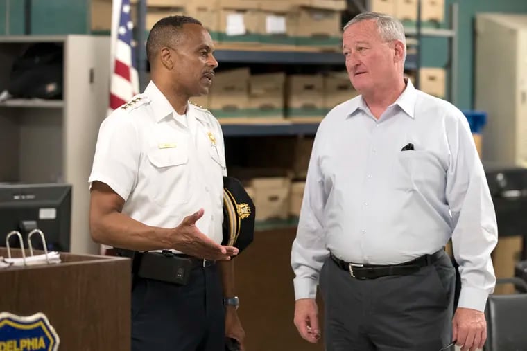 Philadelphia Police Commissioner Richard Ross, Jr., left, and Mayor Kenney speak before a tour at the 12th District Police Station on June 22, following a bloody weekend in the City and a few weeks after an explosive report on officers' social media posts.