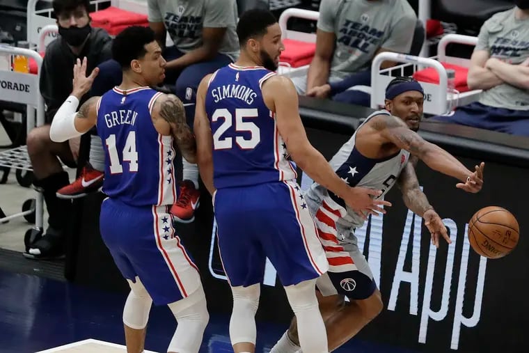 Danny Green stands by Ben Simmons as Wizards guard Bradley Beal passes the ball in a May playoff game. Green still stands by Simmons.