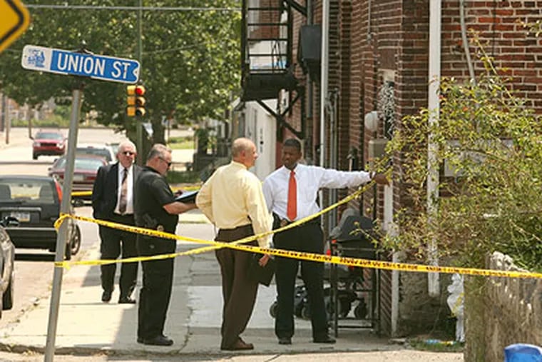 A violent summer continues in the city of Chester with another shooting just two hours after a state of emergency ended. Chester police detectives gather at West Union Streets intersection with Pendell Street. (Charles Fox / Staff Photographer)
