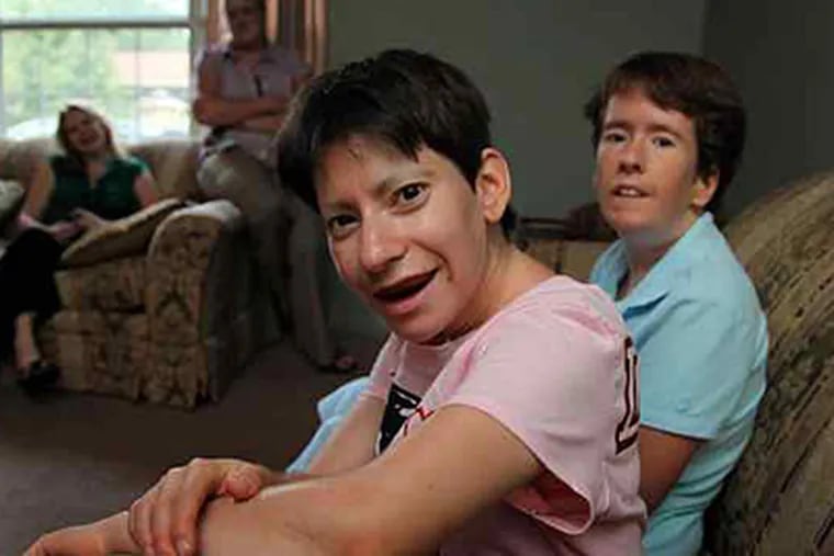 Gabriella Eisen (left) and Erin Kilgallon have the genetic disorder, which causes them to never feel full. (Laurence Kesteron/Staff)