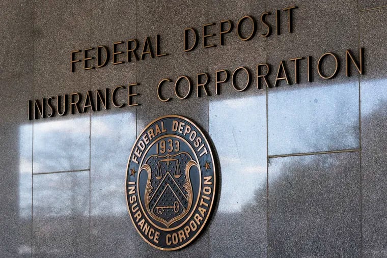 The Federal Deposit Insurance Corporation (FDIC) seal is shown outside its headquarters from 2023 in Washington.