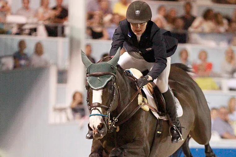 Kelli Cruciotti on Chamonix H became the youngest rider to win the Devon Horse Show Grand Prix on May 29, 2015. (Charles Fox/Staff Photographer)