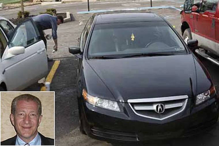 Bucks County detectives work around Eric Birnbaum's black Acura after the lawyer who was fatally shot outside his office in Northampton Township on Wednesday. Inset: Eric Birnbaum. (David Maialetti / Staff Photographer)