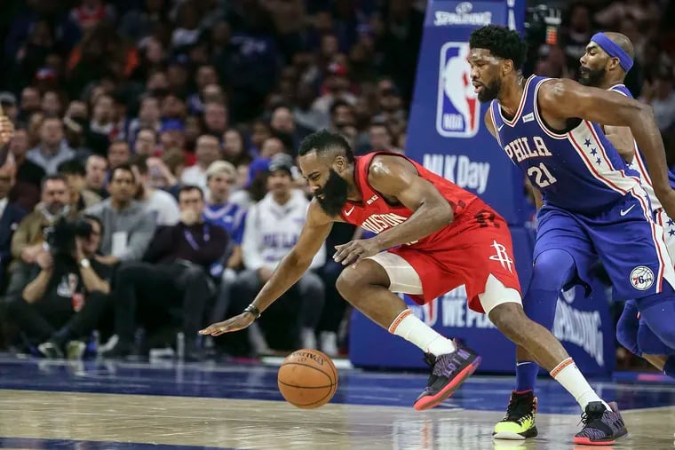 Sixers star Joel Embiid (right) fouls Rockets star James Harden in 2019. Should they be teammates this upcoming season?