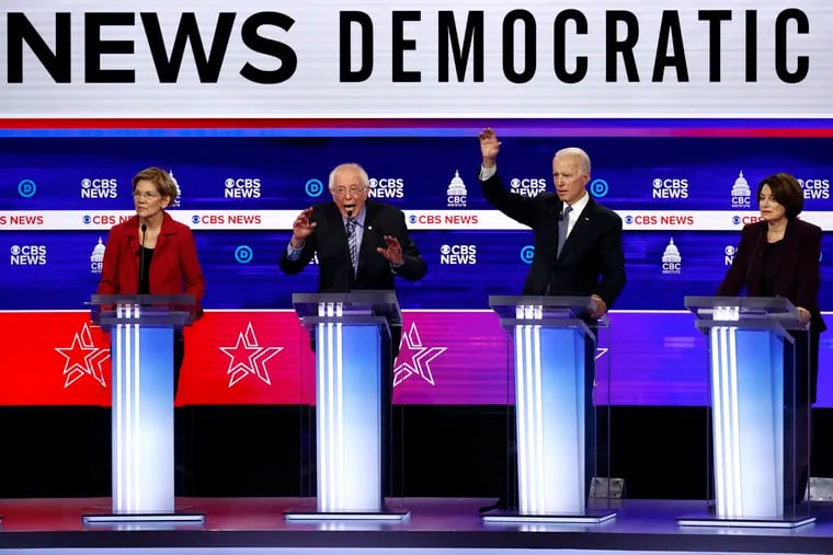 From left, Democratic presidential candidates Elizabeth Warren, Bernie Sanders, Joe Biden, and Amy Klobuchar during a Democratic presidential primary debate in Charleston, S.C., on Feb. 25, 2020.