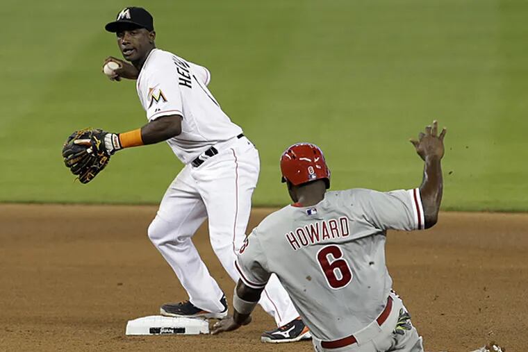 Phillies first baseman Ryan Howard is forced out at second base as Marlins shortstop Adeiny Hechavarria prepares to throw to first on Thursday, May 22, 2014. (Alan Diaz/AP)