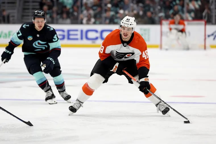 SEATTLE, WASHINGTON - DECEMBER 29: Morgan Frost #48 of the Philadelphia Flyers skates against the Seattle Kraken during the third period at Climate Pledge Arena on December 29, 2023 in Seattle, Washington. (Photo by Steph Chambers/Getty Images)