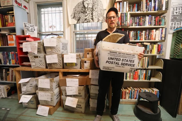 Keir Neuringer and the bins of packages of books that were supposed to go out to PA prison inmates.