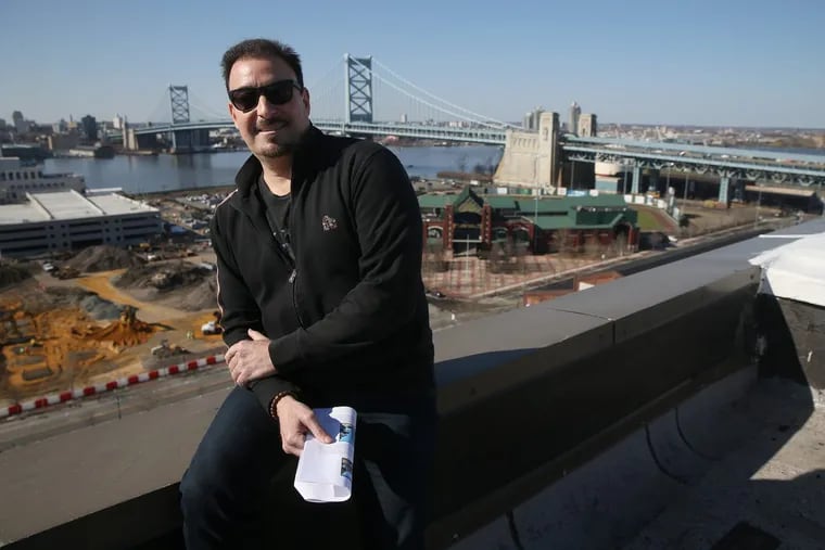 Christopher DiGeorge, CEO of Millennial Partners, sits for a portrait atop the Camden City School District headquarters, formerly an RCA building, in Camden. His firm is purchasing the building and has plans to redevelop it.
