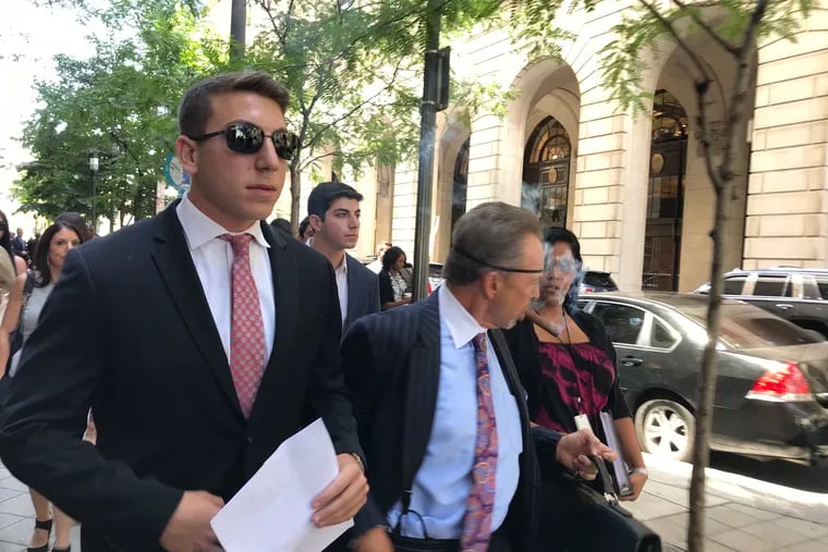 Ari Goldstein, left, former president of Temple University's Alpha Epsilon Pi fraternity, leaves the Criminal Justice Center after a preliminary hearing on July 19, 2018.