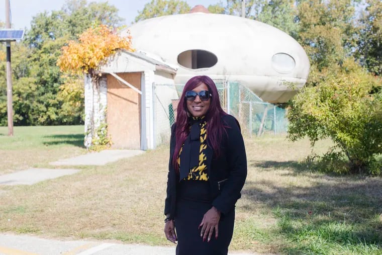 Dionne Bolden, acting director of Recreation and Parks for Willingboro Township, in front of what may be the only intact Futuro house in New Jersey and in the Philadelphia region. The township has owned the house since the 1970s and hopes to have it restored.