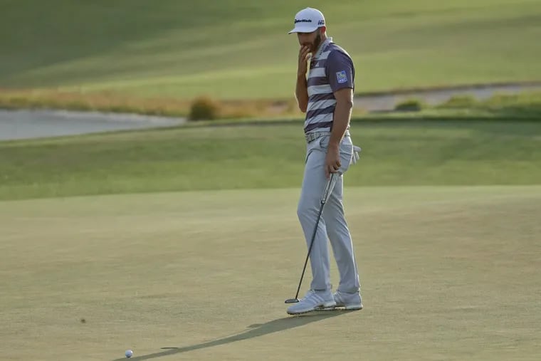 Dustin Johnson misses a putt on the 18th green during the third round of the U.S. Open on Saturday.