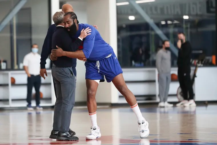 James Harden walks over to say hello to Josh Harris while putting up shots after practice at the Philadelphia 76ers Training Complex in Camden, NJ on Tuesday, Feb. 15, 2022.