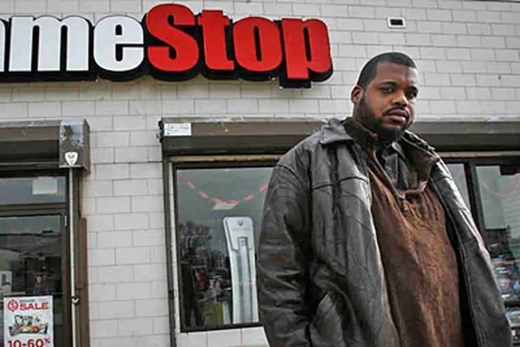 Kevin Hutchinson, 32, of North Philadelphia, was fired from GameStop after a background check revealed a crime he did not commit. (Alejandro A. Alvarez/Staff)