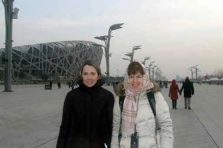 Laura Doyle-Brewster (right) on a trip to China with Fran Duffy, a friend whom she gave care to.