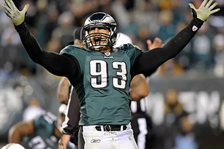 Jason Babin should be relieved that the Eagles are staying with the wide-nine alignment next season. (Michael Perez/AP)