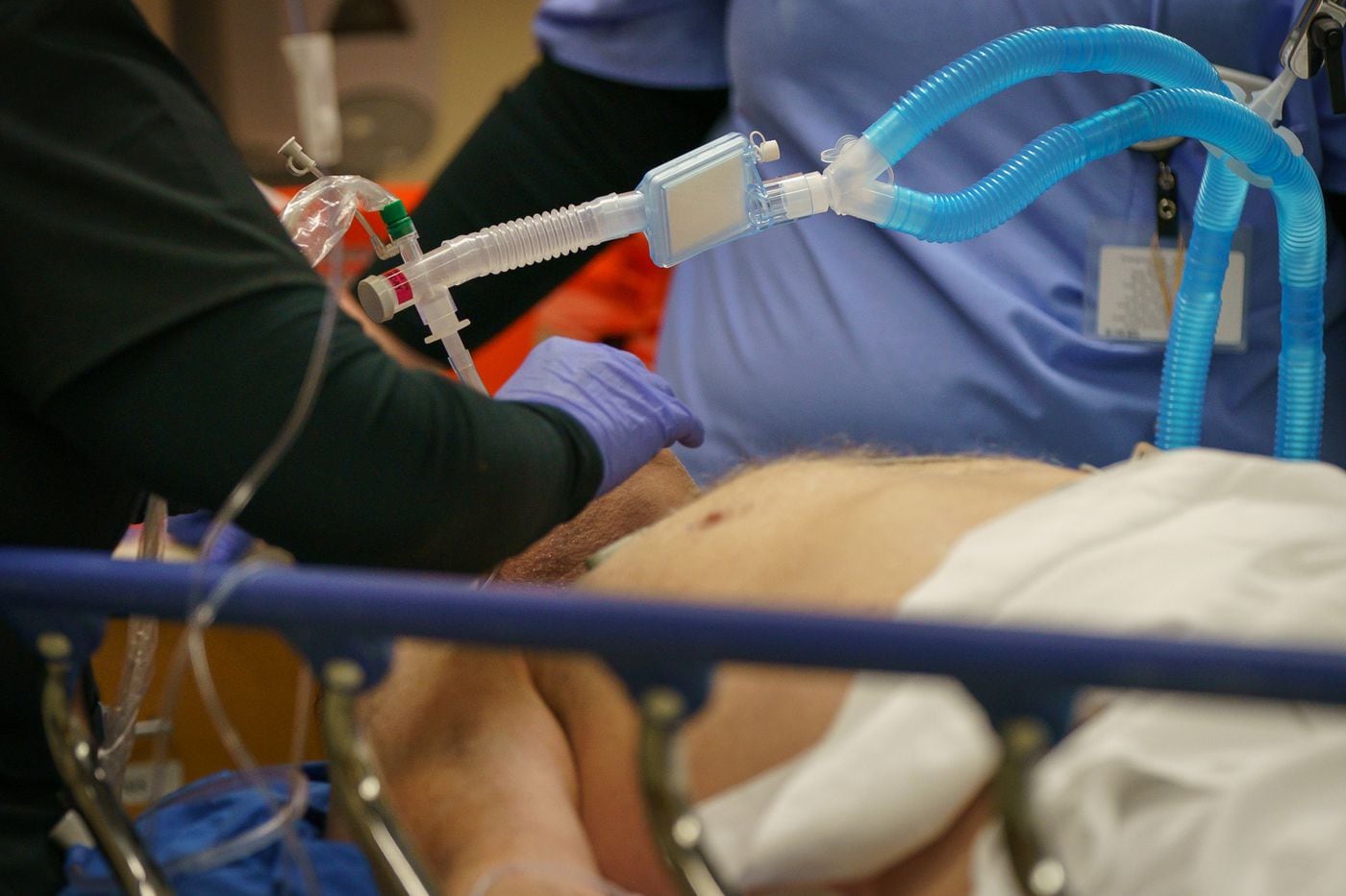 Hospital ER staff intubate a critically ill patient last month at Suburban Community Hospital in …