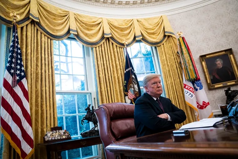 President Trump sits at his desk in the Oval Office during an interview Tuesday with The Washington Post.