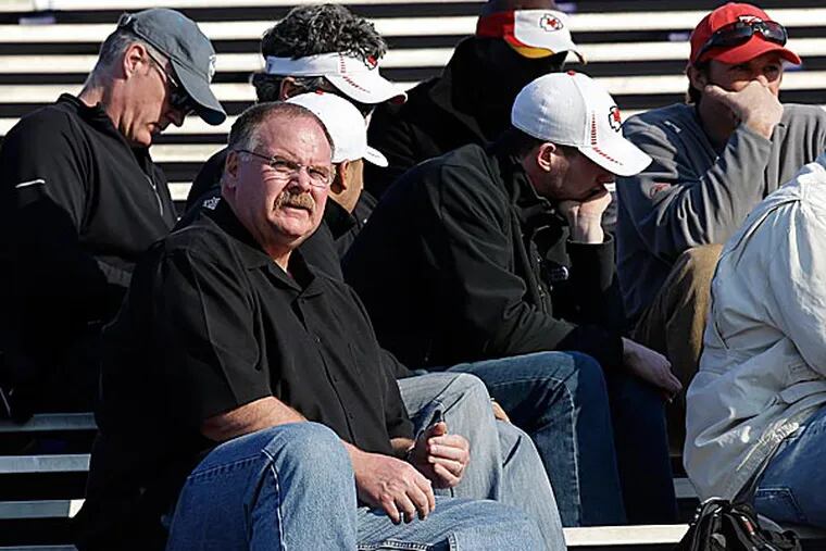 Same familiar black short-sleeve shirt, different surroundings. Andy Reid was sitting with some of his new Kansas City Chiefs cohorts Tuesday afternoon. (Dave Martin/AP)