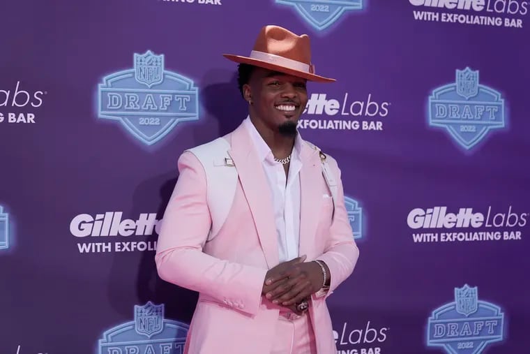 Georgia linebacker Nakobe Dean posing for photos before the first round of the NFL football draft Thursday in Las Vegas.