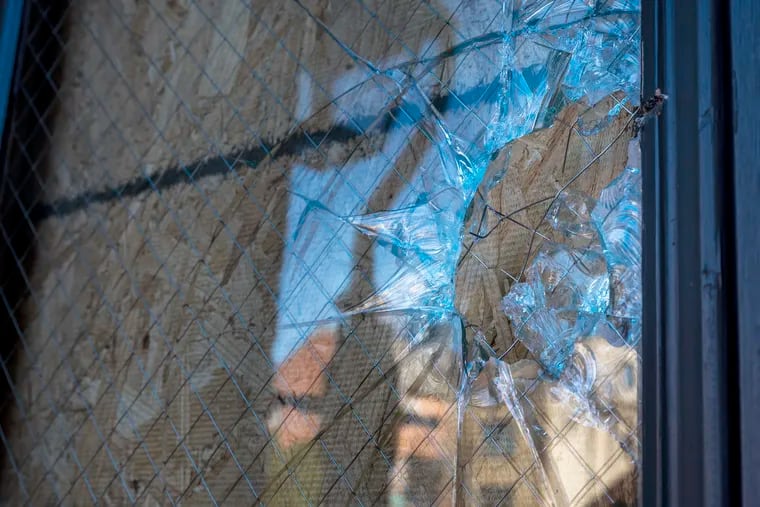 The damaged glass in a side entrance door at Mother Bethel AME Church Tuesday, Feb. 20, 2024. Philadelphia police are investigating an act of vandalism at the historic church in Society Hill, including stained glass that will require skilled craftsman to repair.