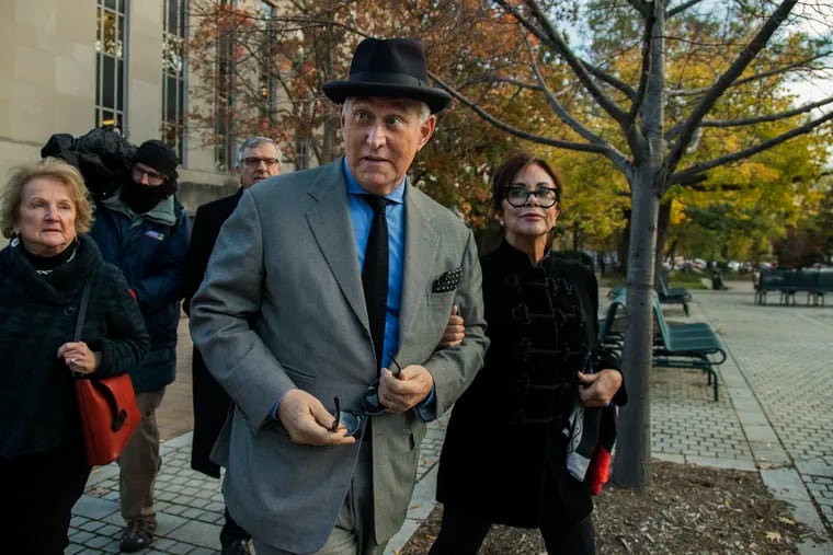 Roger Stone (center) walking out of federal court in Washington on November 12.