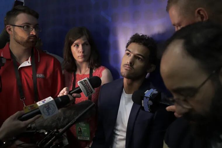 Trae Young (center) met with the Sixers on Friday.