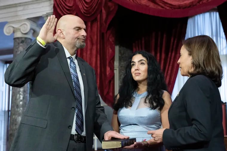 Vice President Kamala Harris (right) participates in a ceremonial swearing-in of Sen. John Fetterman, (D., Pa.) as his wife, Gisele, holds a Bible in the Old Senate Chamber on Capitol Hill in Washington, D.C., on Tuesday.