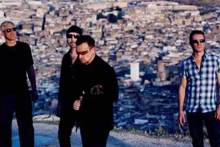 U2 front man Bono (front), bass player Adam Clayton (left), guitarist the Edge, and drummer Larry Mullen Jr. have released their first CD in four years.
