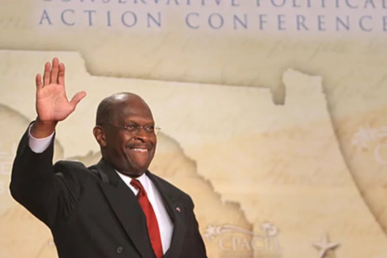 Herman Cain greets those attending the Republican Party gathering in Florida. “The Herman Cain train is picking up steam,” he said. (Joe Burbank / Associated Press, pool)