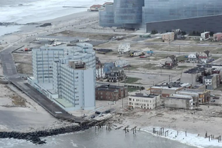 The northern tip of Atlantic City on Tuesday, Oct. 30, 2012 shows where the boardwalk was destroyed after Hurricane Sandy blew across the area. Revel casino is in the top portion of the photo. (Clem Murray / Staff Photographer)