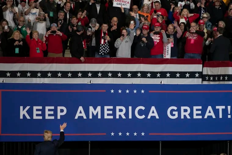 Then-President Donald Trump exits and acknowledges the crowd after a Keep America Great campaign rally in Wildwood, N.J., in 2020.