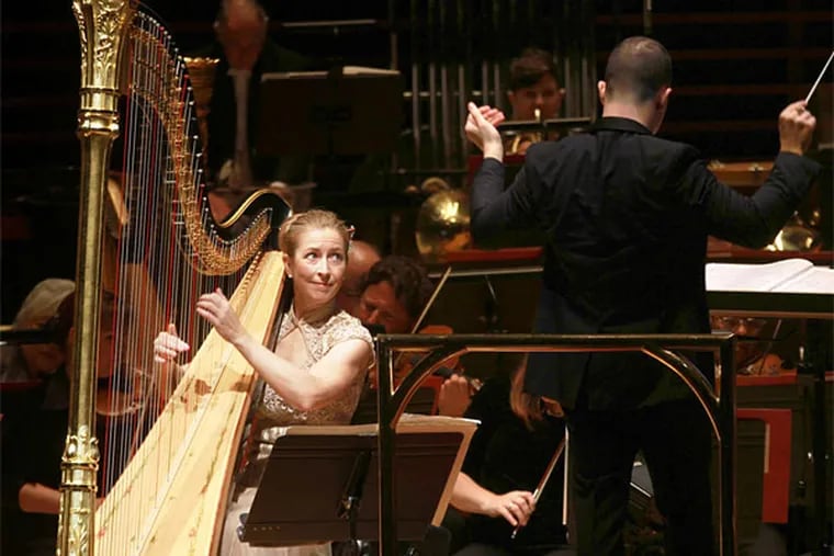 Principal harp Elizabeth Hainen and music director Yannick N&#0233;zet-S&#0233;guin; she is neglected in parts of &quot;Nu Shu.&quot;