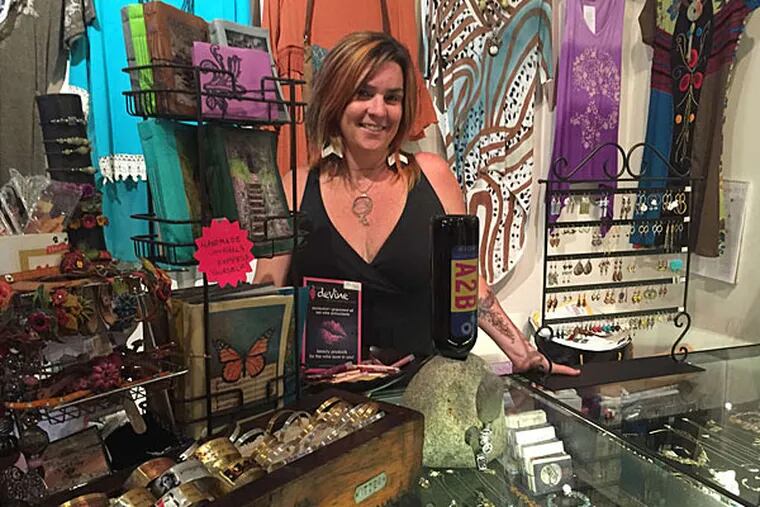 Mary Harvey, co-owner of Urban Princess, shows off some of her shop's most popular items.
