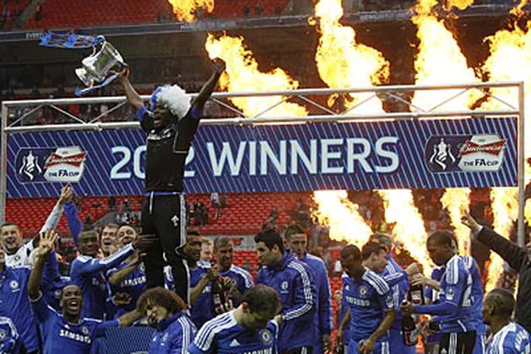 The Chelsea team celebrates winning the FA Cup on Saturday at Wembley Stadium in London. (Tim Hales/AP)