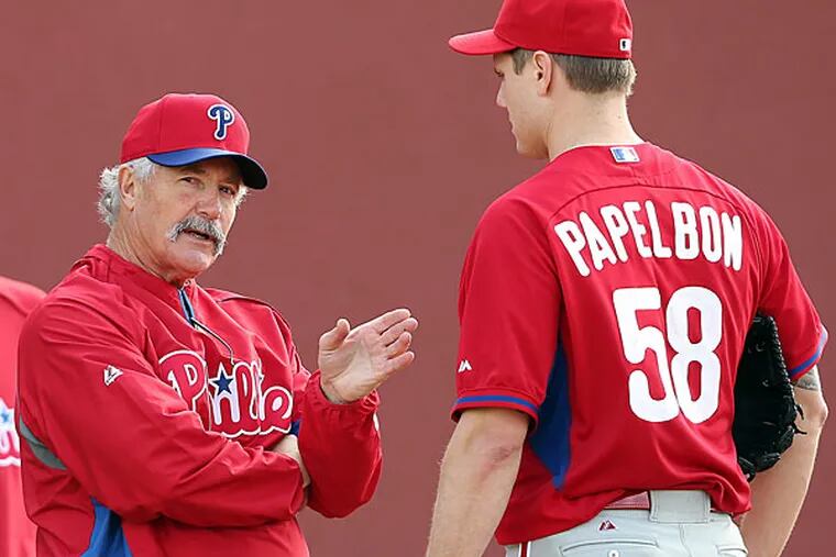 Phillies pitching coach Bob McClure (left) talks with Jonathan Papelbon during spring training. (David Maialetti/Staff Photographer)