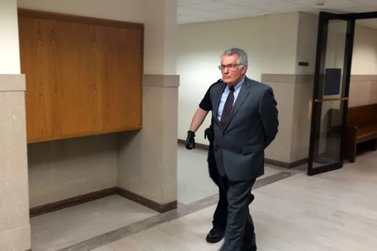 Marshall Perlman leaves a Montgomery County courtroom after being sentenced to 3 to 21 years in state prison for stealing from clients of his insurance adjustment business. (Laura McCrystal / Inquirer Staff)