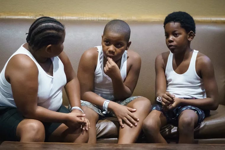 (Left to right) Linwood Bowser, Zakhai McCleary, and Jahzear Gredic, spend time together during a retreat organized by Moms Bonded By Grief, attended by Philadelphia children and their families who have been impacted by gun violence, at the Kalahari Resorts Waterpark, in the Poconos, August 27, 2021.
