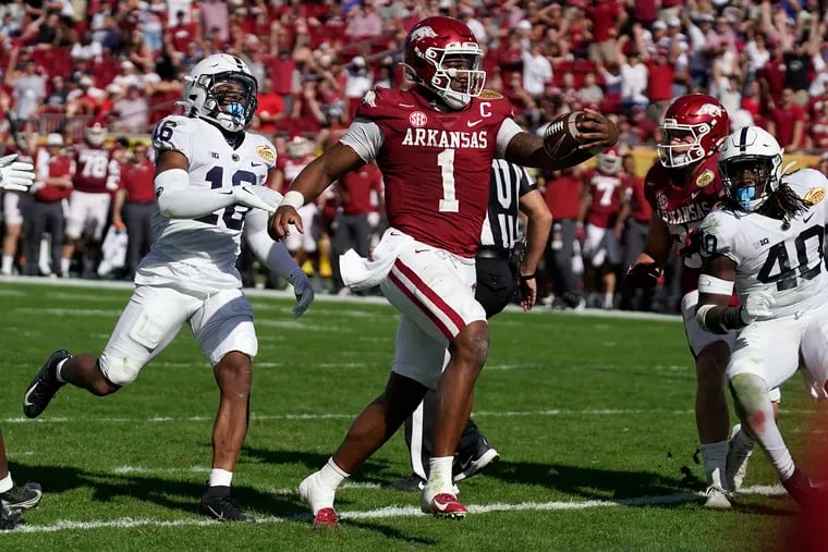 Arkansas quarterback KJ Jefferson scores on an 8-yard run against Penn State during the second half of the Outback Bowl.