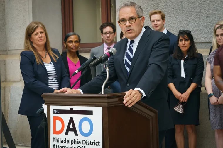 DA Larry Krasner speaks at a news conference about the work of the Conviction Integrity Unit. CIU chief Patricia Cummings is seen in the back left.