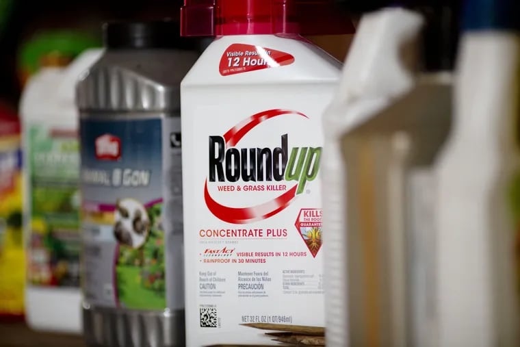 A bottle of Bayer AG Roundup brand weedkiller concentrate is arranged for a photograph in a garden shed in Princeton, Ill., in 2019.
