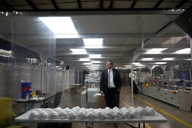 Jim Schmersahl, owner of Halcyon Shades, poses in a "clean room" used in making N-95 masks at the company's production facility in University City, Mo.