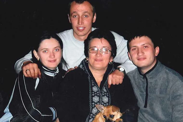 Mariya Plekan, center, with (clockwise from left) daughter Nataliia Holovchak, left; her husband, Igor Holovchak; Mariya’s son, Andrii Plekan, 25. (courtesy photo)