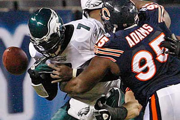 Michael Vick was sacked four times in Sunday's loss to the Bears. (Ron Cortes / Staff Photographer)